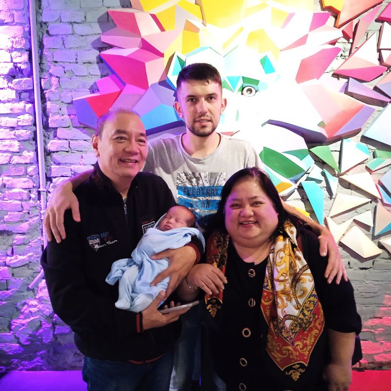 Andrew Khomenchuk with the Averia family and newborn Baby Jesson in Kyiv — Novaparent surrogacy founder