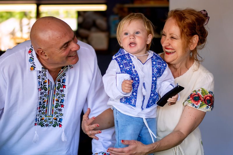 Cibi family in Ukrainian vyshyvanka shirts at their son's first birthday — Novaparent surrogacy testimonial, Australia